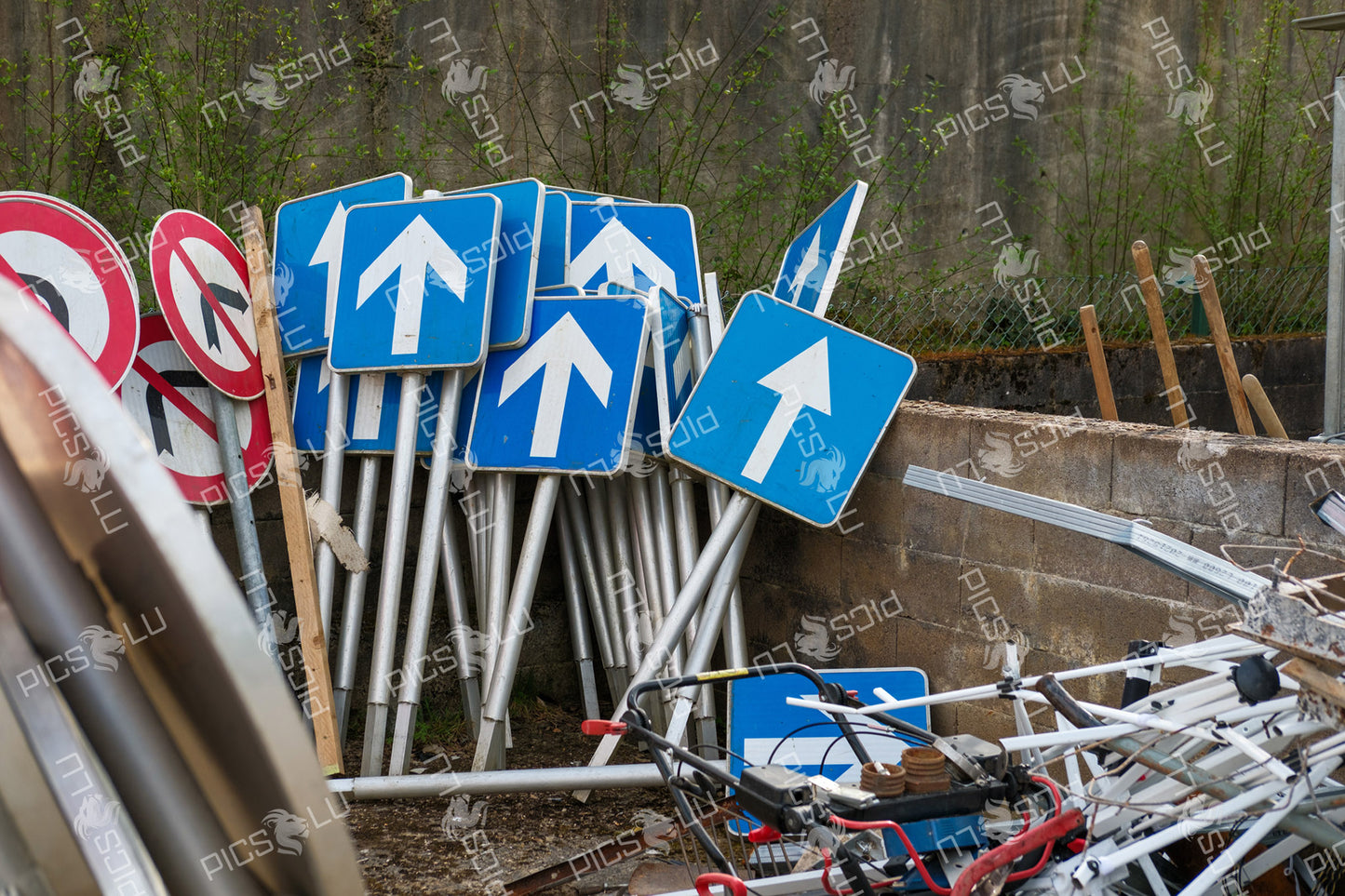 One-way traffic signs stacked at depot in Contern, Luxembourg