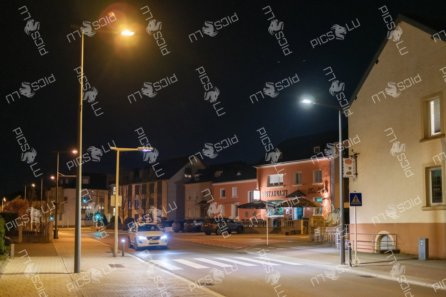 Restaurant by the street at night in Sandweiler, Luxembourg