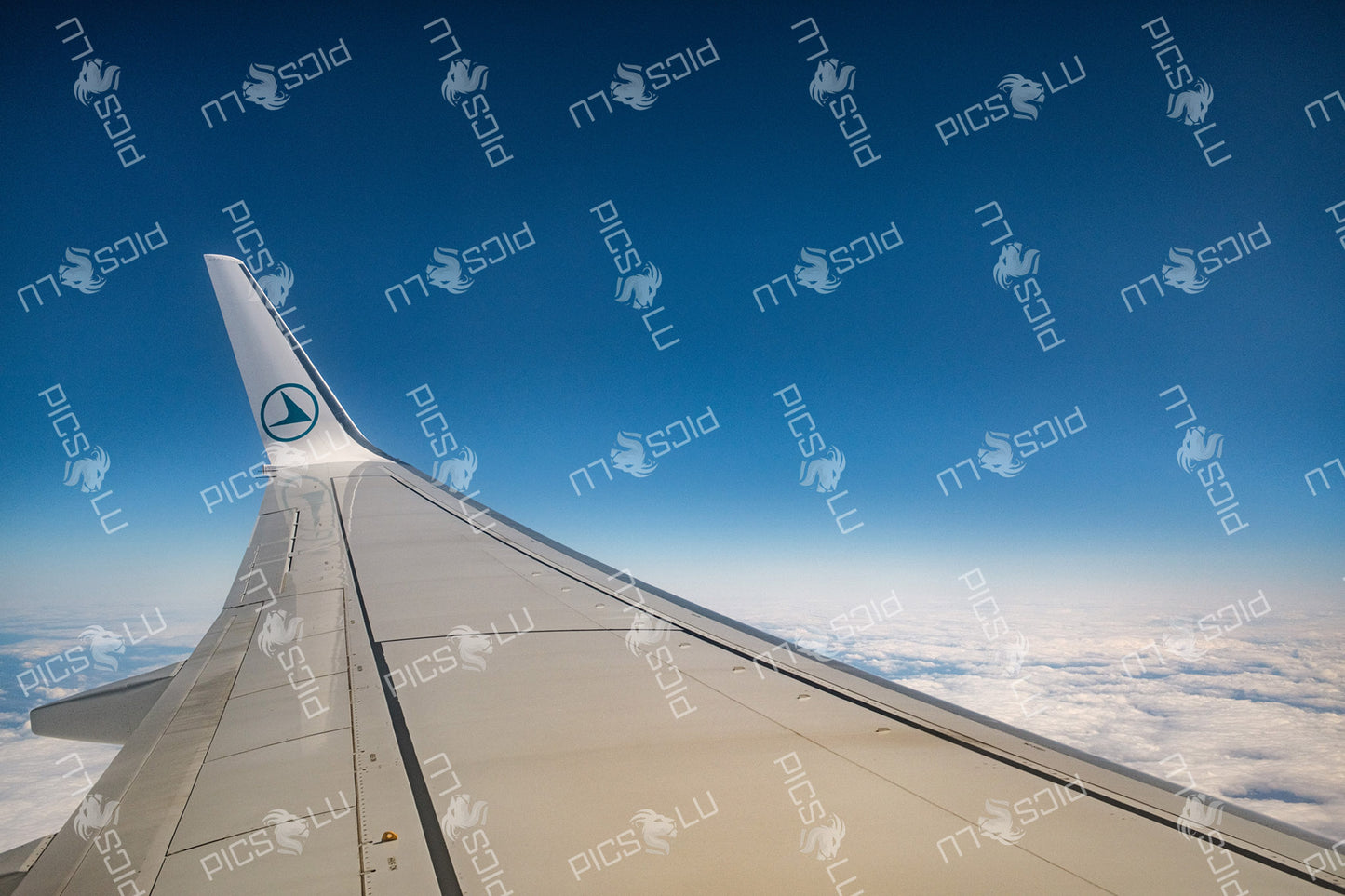 View from Luxair plane window above the clouds