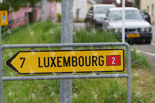 Road sign pointing to Luxembourg