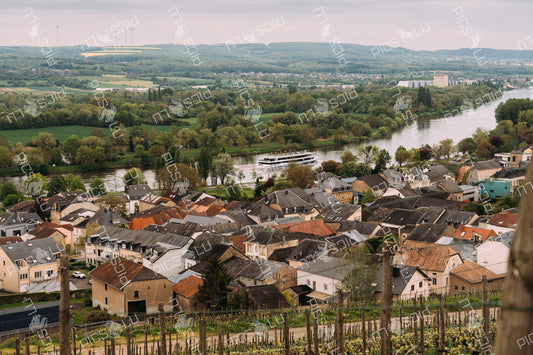 Scenic view of Remich with cruise boat on Moselle River