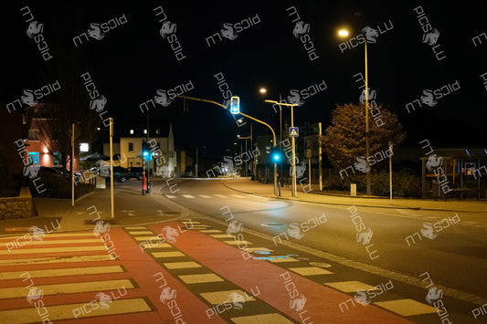 Night street view with traffic lights in Sandweiler