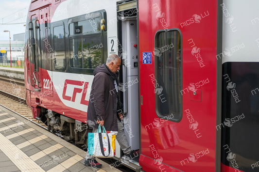 Passenger boarding a CFL train in Luxembourg