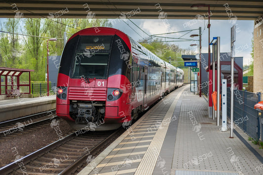 Red CFL train at Contern railway station in Luxembourg