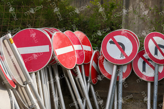 Prohibition signs stacked against wall at depot in Contern, Luxembourg