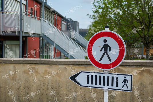 Pedestrian Prohibited Sign with Zebra Crossing Direction – Sandweiler, Luxembourg