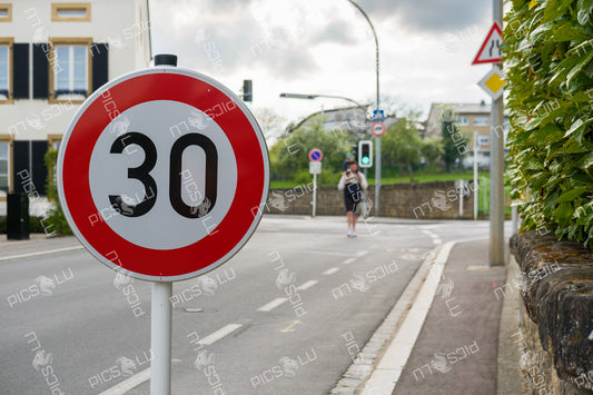 Speed limit 30 sign with pedestrian in Sandweiler
