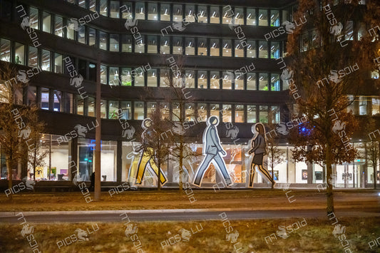 Office building with walking figure art installation in Kirchberg Luxembourg