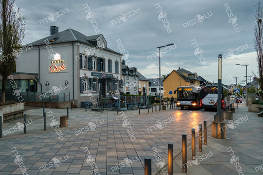 Early buses at Sandweiler square near Pizzeria Gusto
