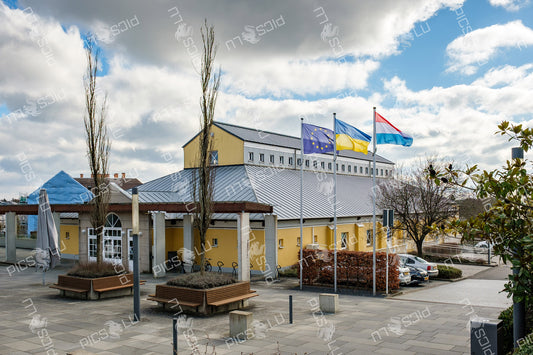 Flags outside cultural center in Sandweiler, Luxembourg