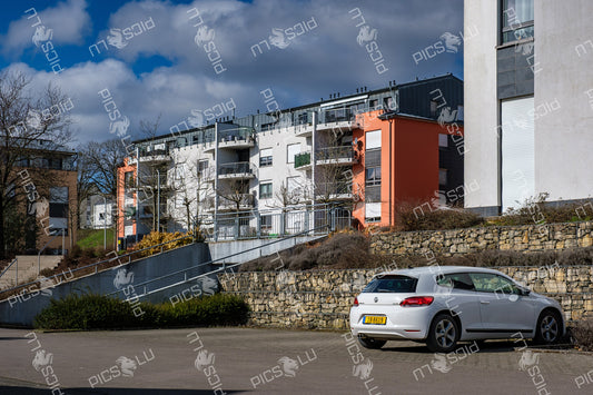 Residential buildings in Sandweiler under spring sunlight