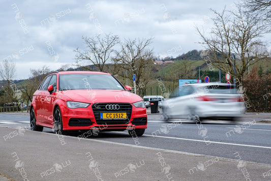 Red Audi parked near vineyards in Remich, Luxembourg