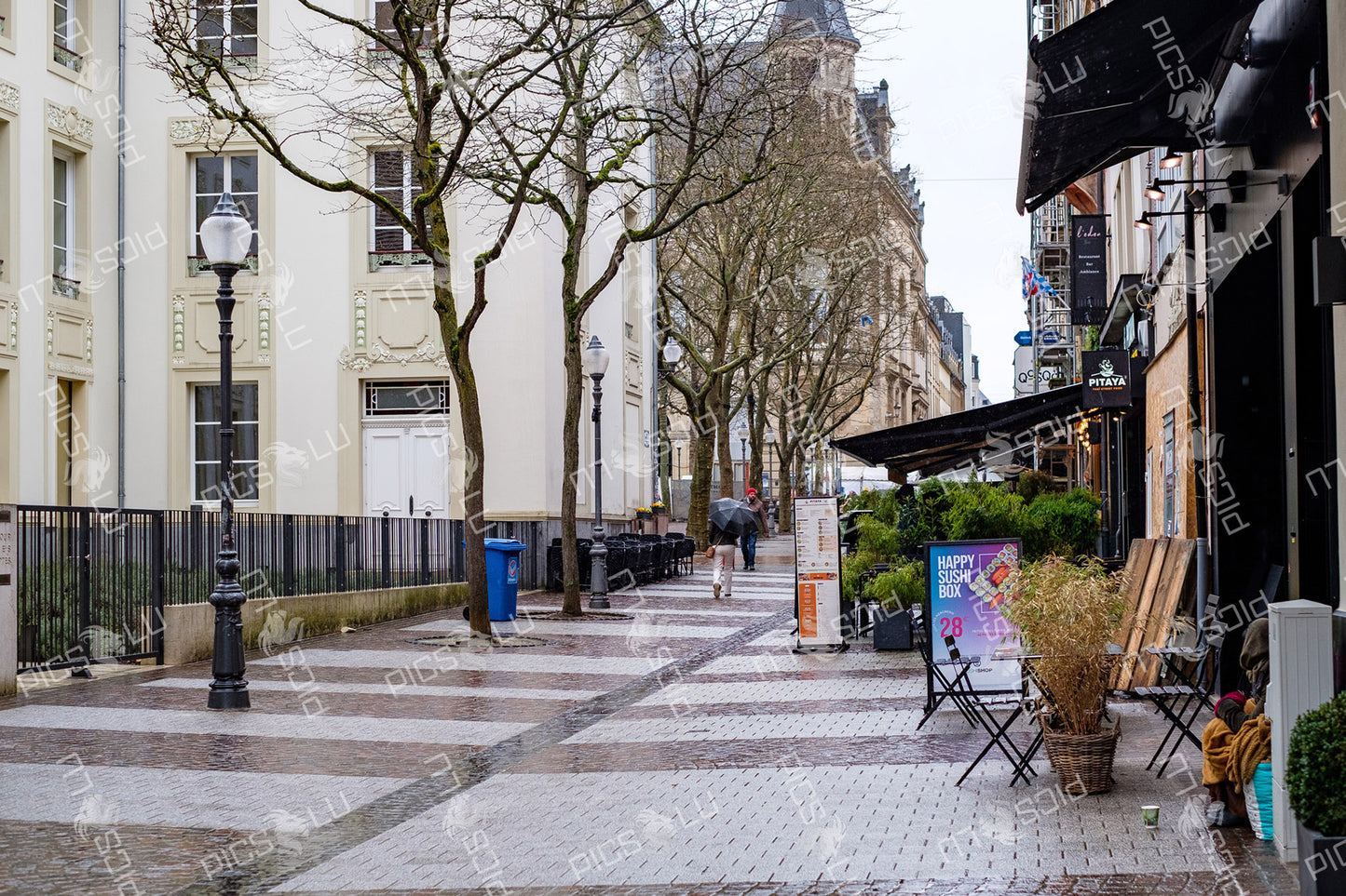 Rainy pedestrian street with restaurants in Luxembourg City