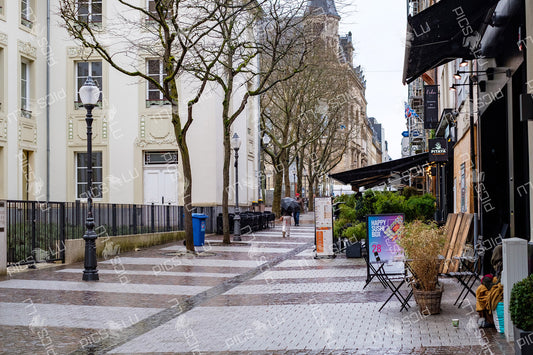 Rainy pedestrian street with restaurants in Luxembourg City