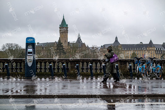 Rainy day at Adolphe bridge in Luxembourg city with vel'oh station