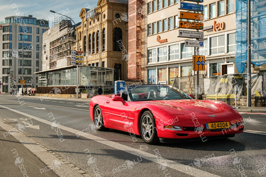 Red Corvette drives through Luxembourg City