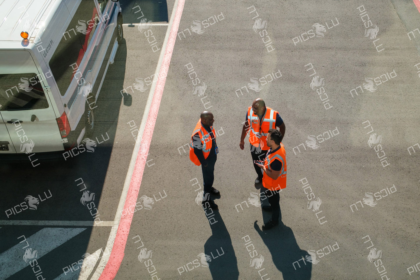 Ground crew in discussion at Luxembourg Airport