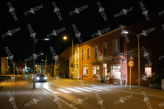 Evening traffic in front of Sandweiler Stuff in Sandweiler