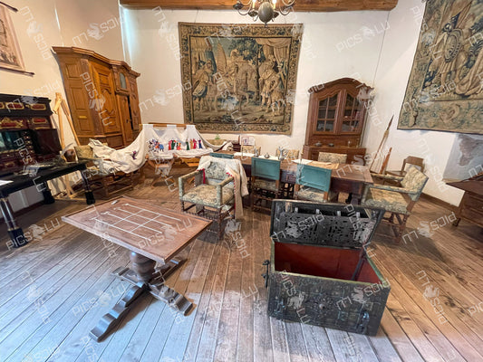 Historical furniture and embroidery display inside Vianden Castle