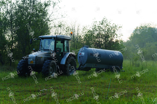 Tractor with water tanker on a meadow in Luxembourg
