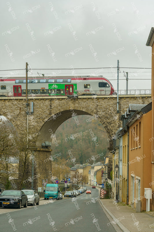 CFL train crossing stone viaduct in Pfaffenthal, Luxembourg
