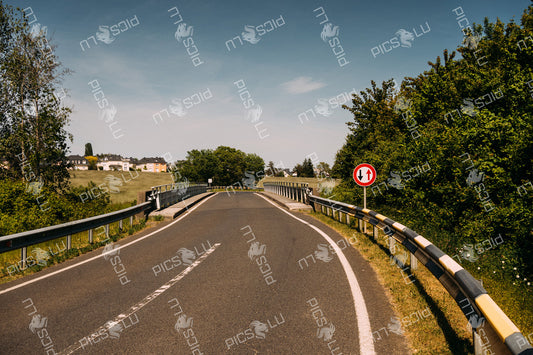 Narrow bridge with priority road sign near Senningerberg