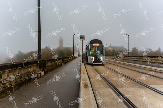 Tram Crossing the Adolphe Bridge on a Foggy Morning